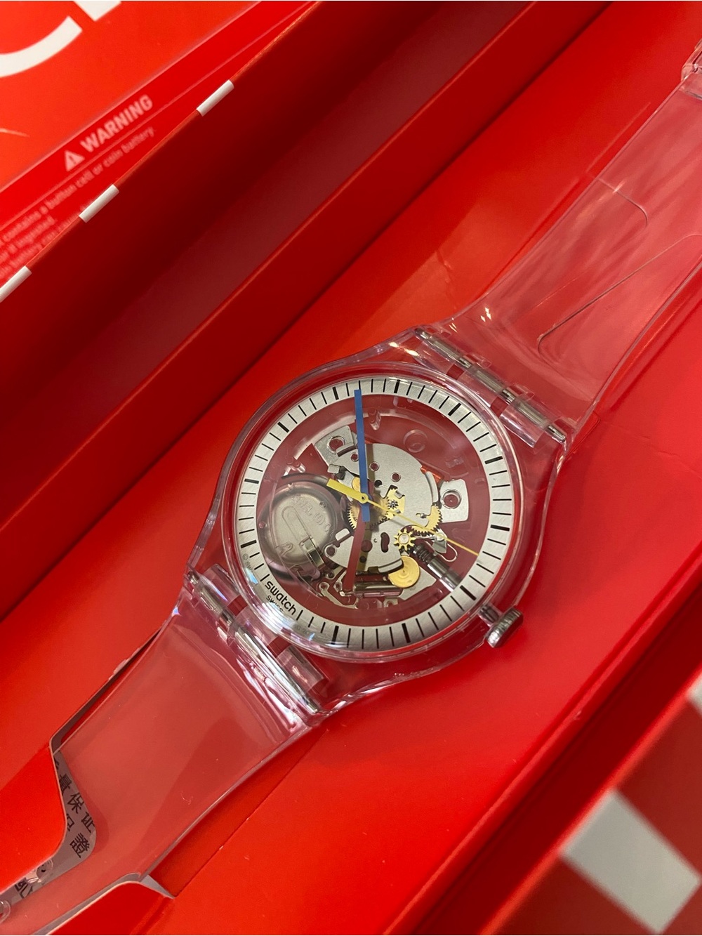 Swatch Transparent Strap Skeleton Watch with Blue Second Hand